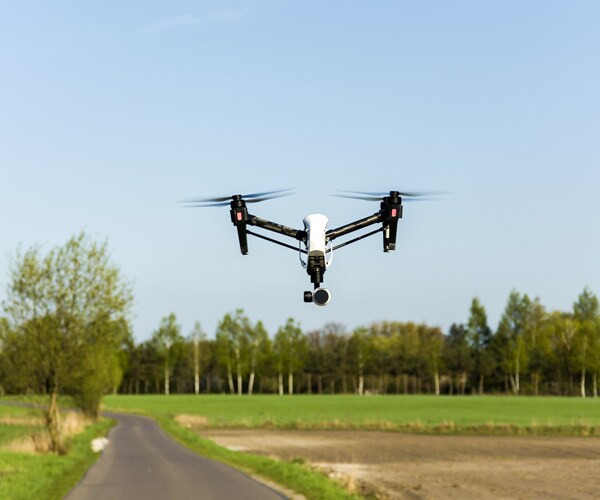 a drone flying above a road