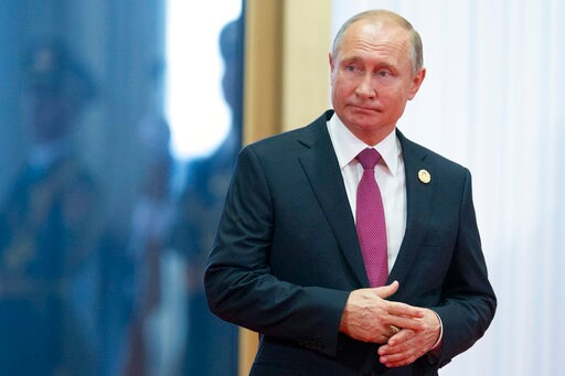 The Latest: Putin Says Ready to Meet Trump