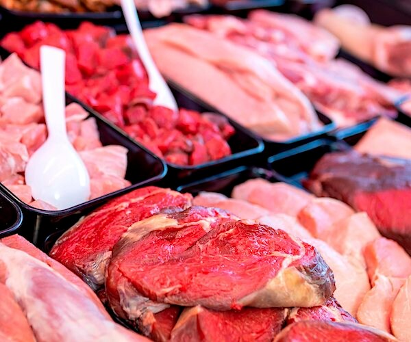 a meat market displays a variety of raw red meat for sale