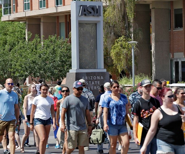 students walk on university avenue at arizona state university