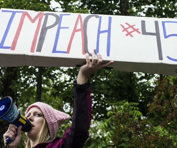 Protester Projects #FireSessions on Justice Dept., FBI Buildings