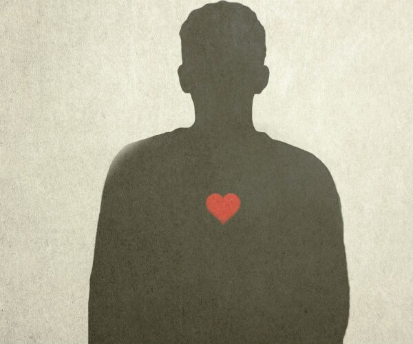 Red heart on silhouette of man (Ikon Images via AP Images)