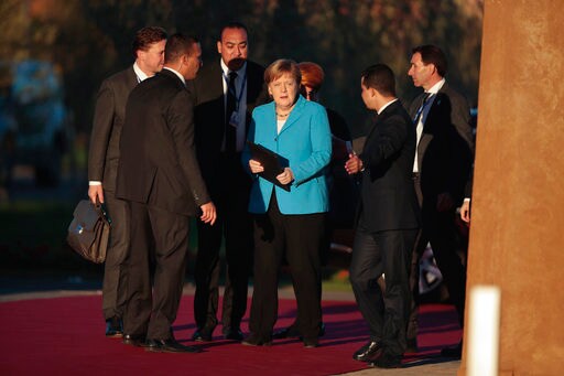 The Latest: German Court Rejects Case against Migration Pact