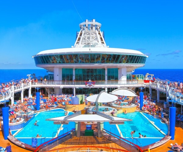 people on cruise ship deck and in pool