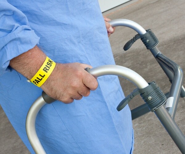 man using walker wearing fall risk bracelet