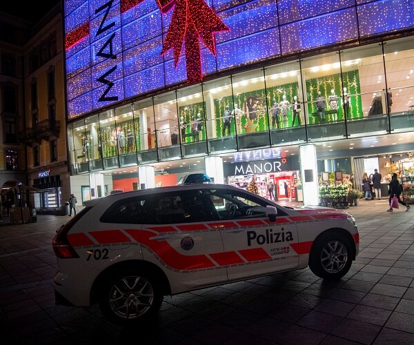 police car sits in front of shopping center