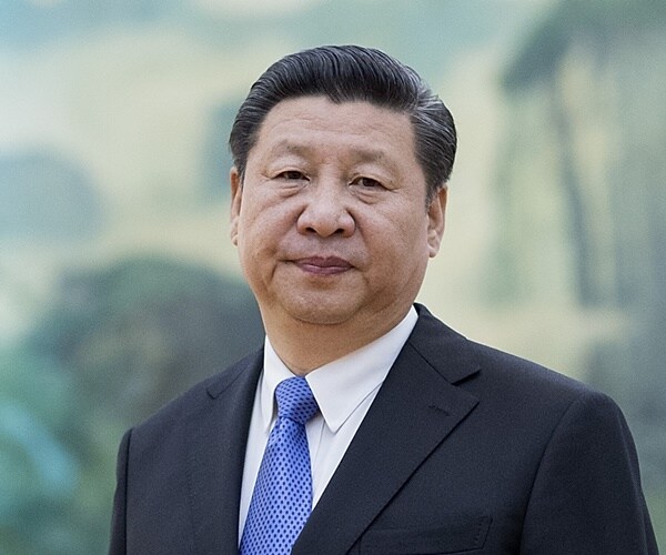 China's Xi Threatens Taiwan with Force, But Also Seeks Peaceful 'Reunification'