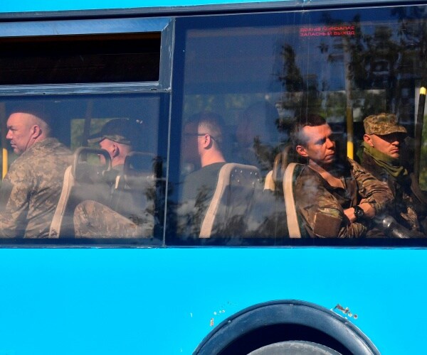 ukrainian service members inside a bus