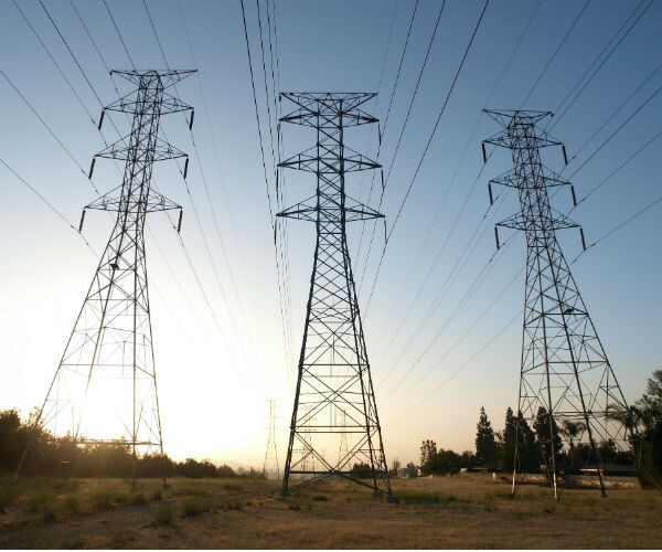electrical power towers at sunrise in southern california 
