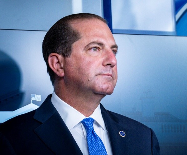alex azar stands in press room