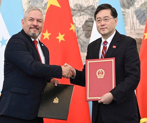 China established diplomatic ties with Honduras on Sunday after the Central American country ended i...