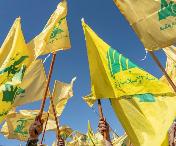 hezbollah flags at a rally