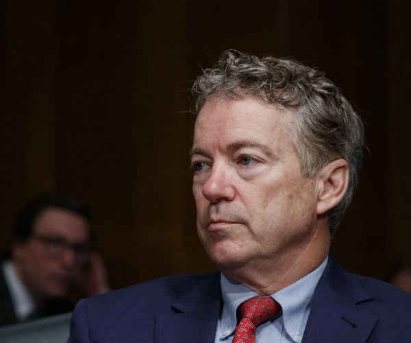sen. rand paul pauses before a senate committee hearing on capitol hill in washington