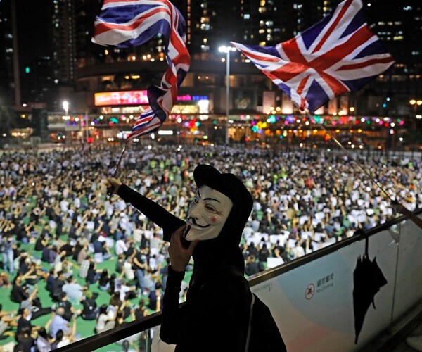 Tens of Thousands Protest in Hong Kong, Clash With Police