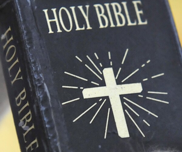 a close up view of a hard-bound holy bible