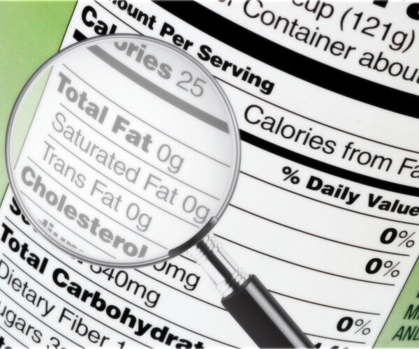 nutrition label on can, with magnifying glass