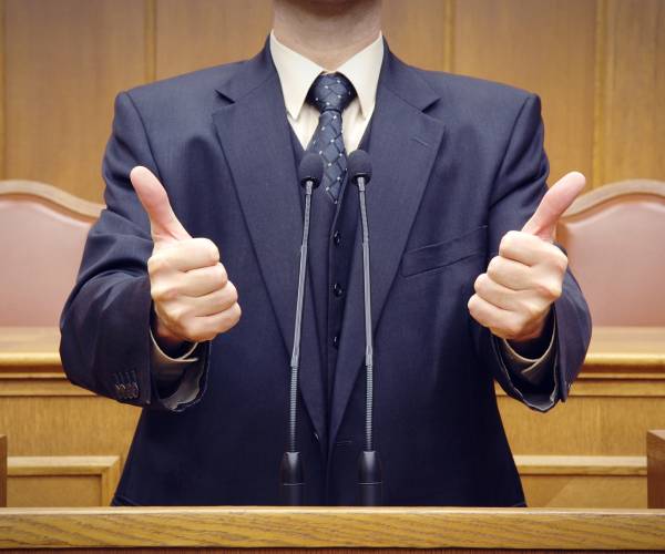 a politician giving two thumbs up