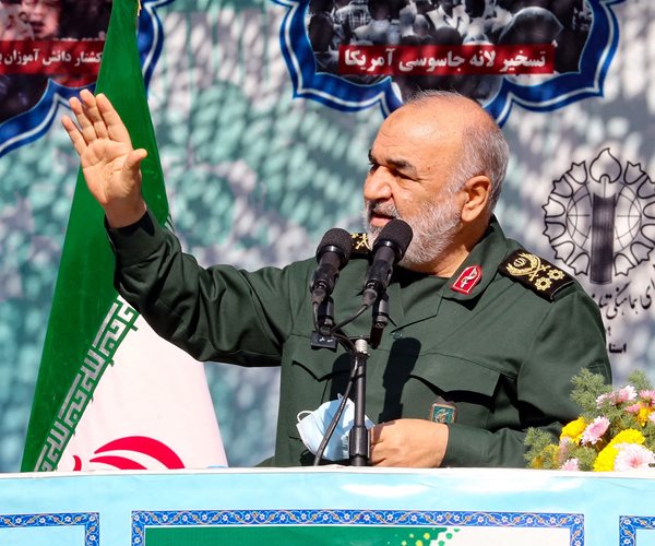 Hossein Salami gestures while speaking into a microphone