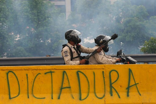The Latest: Venezuela Officials: 12 Dead Overnight Violence