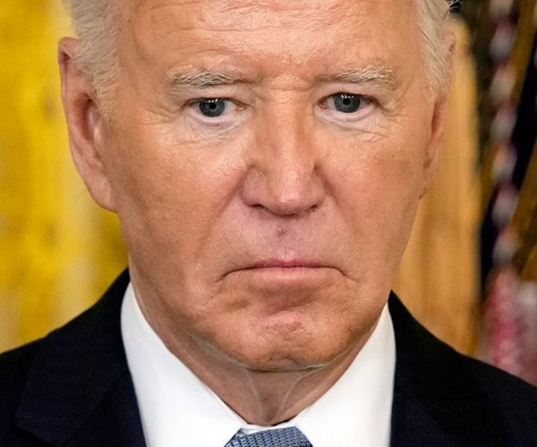 Joe Biden looks on