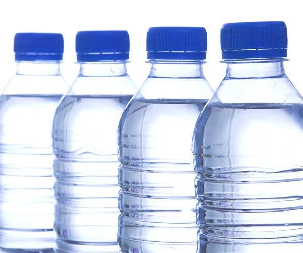 four bottles of water without labels