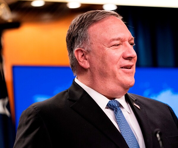 mike pompeo talks into microphone