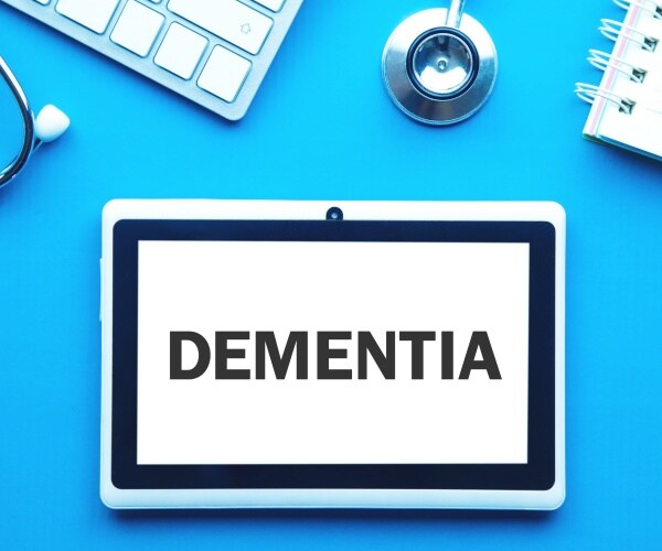 'Dementia' on screen of tablet, stethoscope