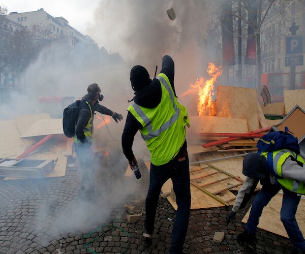 Tear Gas on the Champs-Elysees but Fewer Paris Protesters