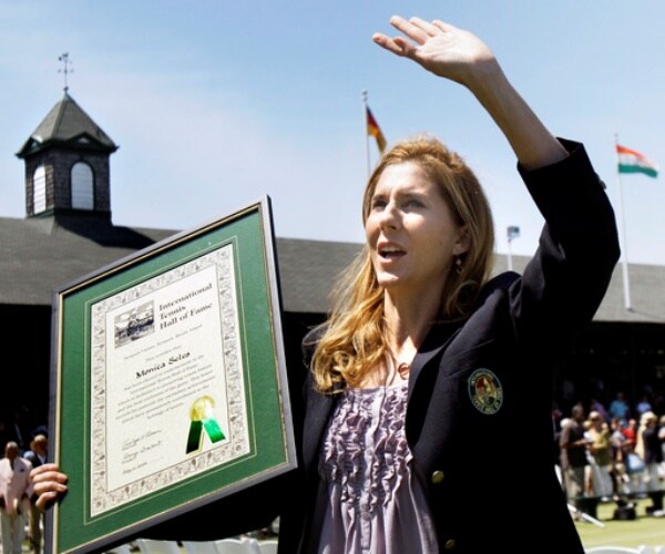 Monica Seles with trophy at tennis event