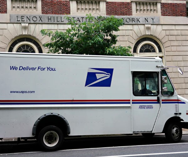 a usps delivery truck is seen parked in new york