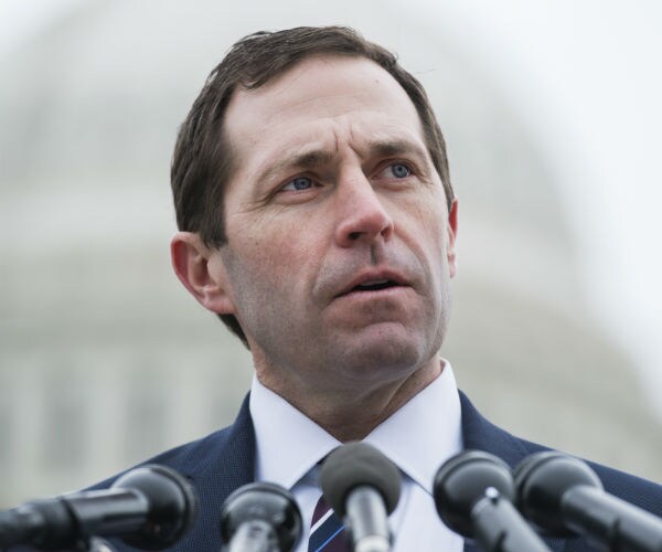 rep. jason crow, one of the house impeachment managers is shown