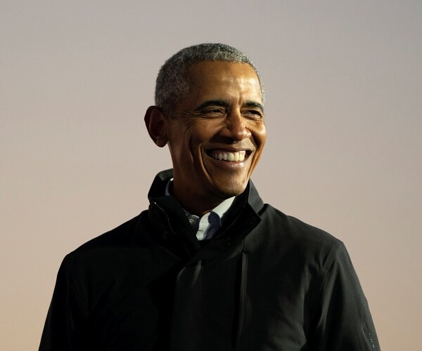 barack obama smiles onstage at campaign event