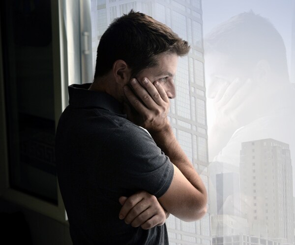 a man looking out the window