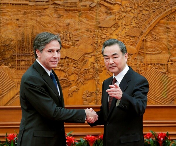 U.S. Secretary of State Antony Blinken, left, shakes hand with Chinese Foreign Minister Wang Yi 