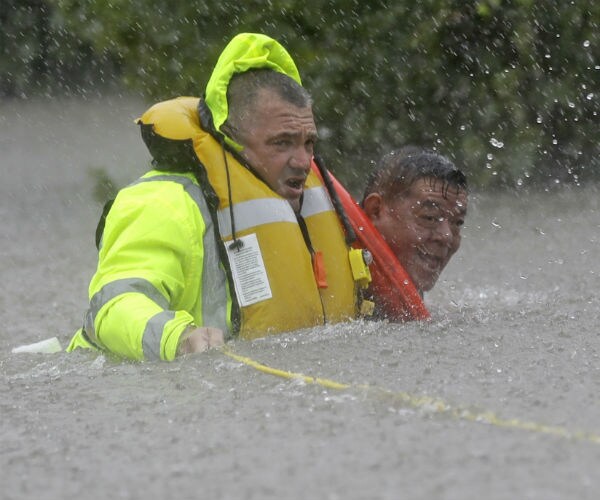 Coast Guard Rescuing People by Helicopter