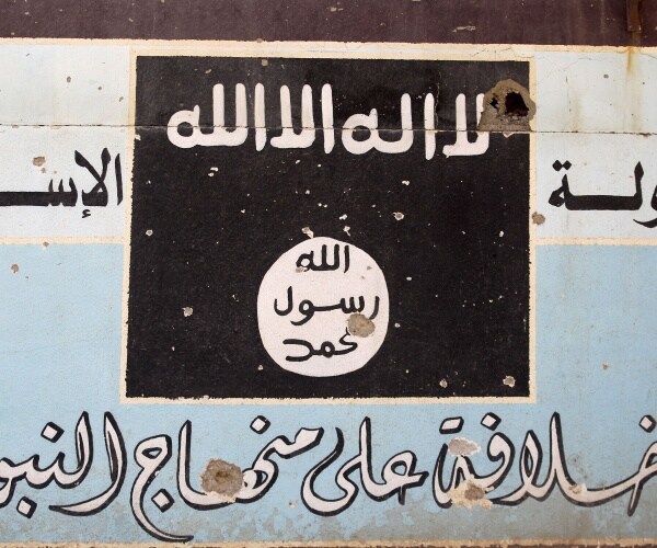 isis flag is shown on a wall mural