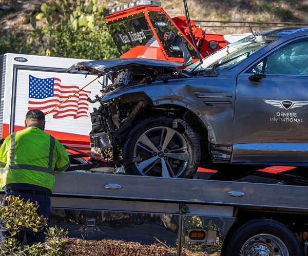 crashed suv on flatbed truck