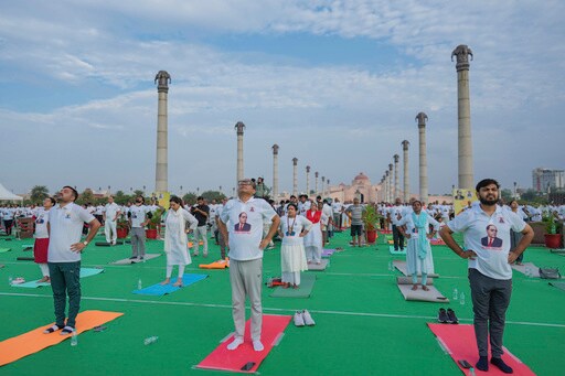 Indians Stretch, Breathe and Balance to Mark International Day of Yoga