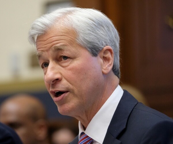 dimon in a suit and blue and red striped tie