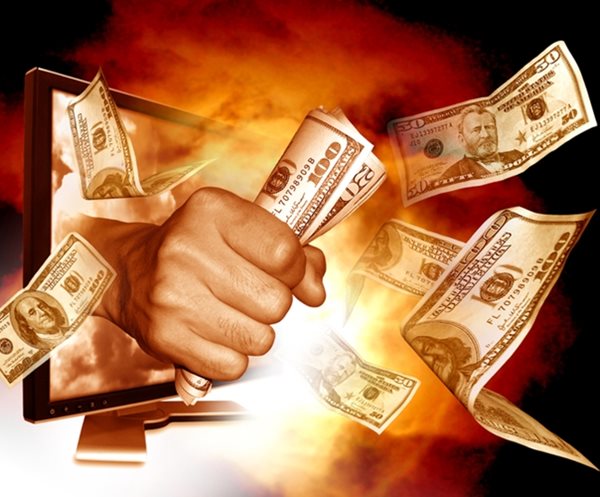 fist punching through fiery computer screen with holding dollar bills