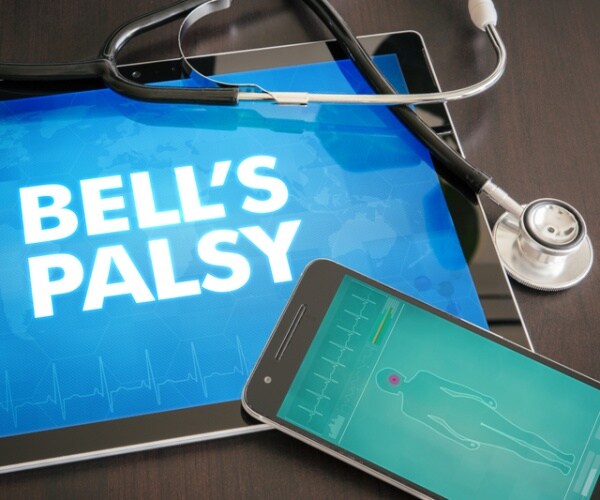 a tablet says bell's palsy next to a stethoscope.