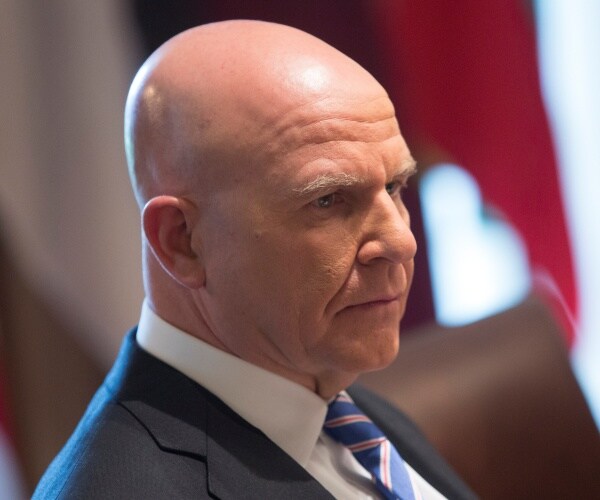 mcmaster in a gray suit and striped tie