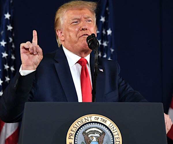 president donald trump gestures and speaks during a speech