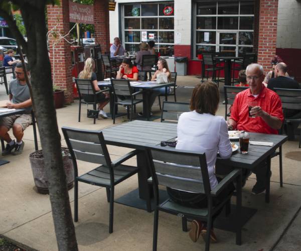 people sitting at an outdoor restaurant