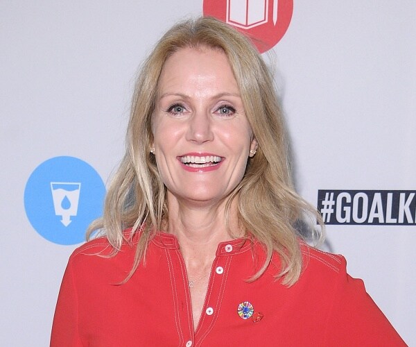 helle thorning schmidt stands on red carpet