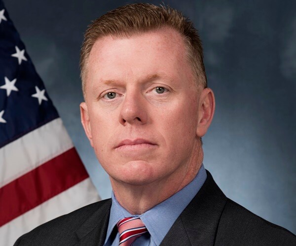 james murray in front of a flat