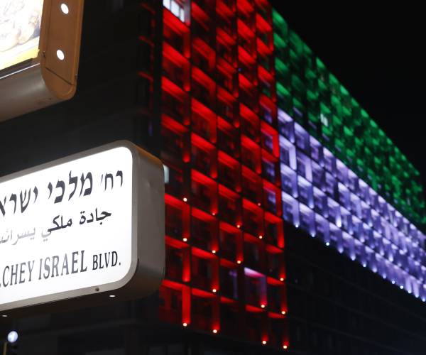 building with colored lights to match the country flag