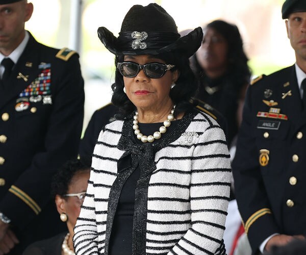 florida democratic representative frederica wilson, wearing a black cowgirl hat, stands are at a news conference