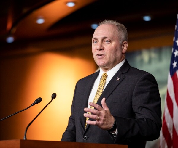 scalise in a suit and yellow printed tie