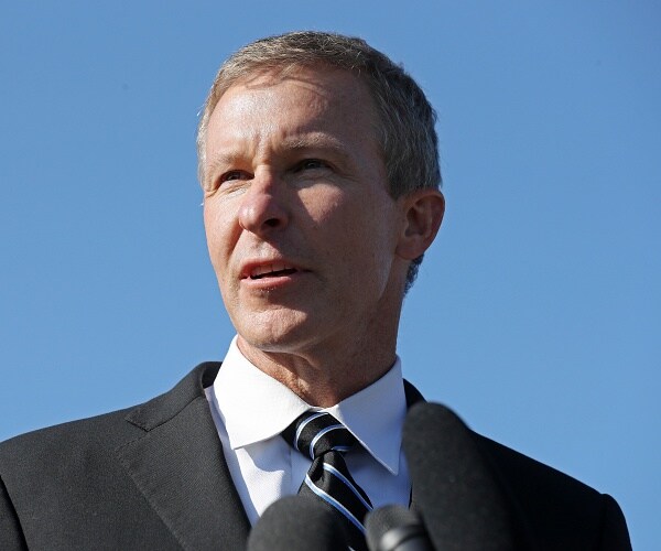scptt kirby stands on steps outside capitol